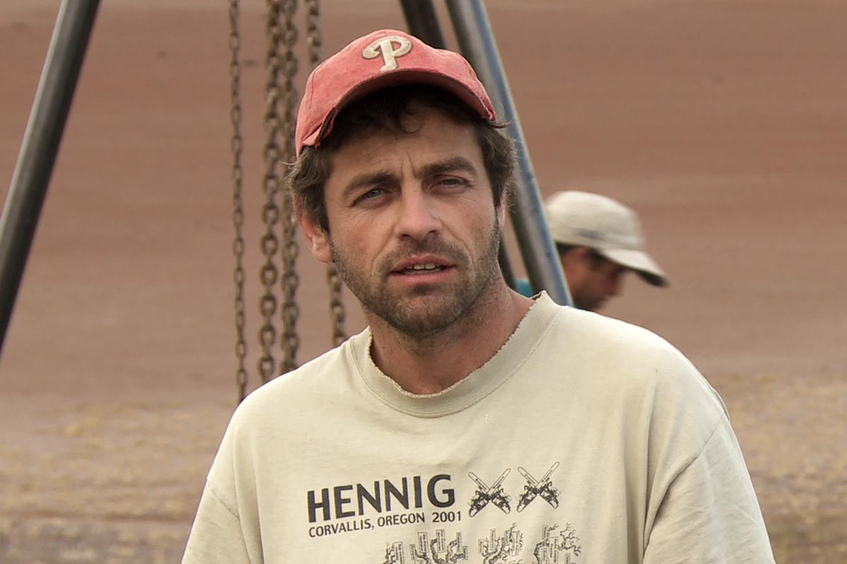 Paleontologist Diego Pol, picture from the shoulders up wearing a t-shirt and baseball cap.