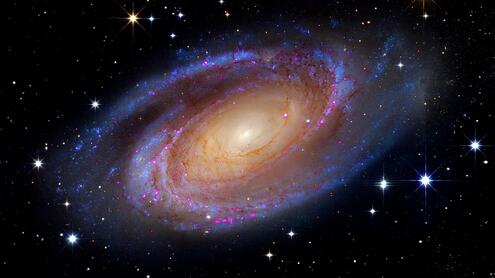 A swirling spiral-type galaxy in space.