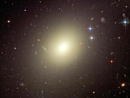 Elliptical-type galaxy, with a bright oval shape. 